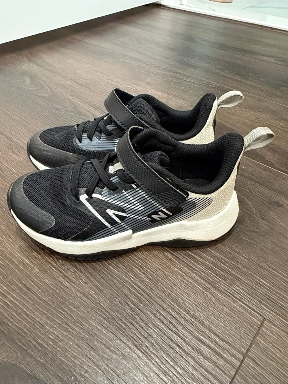 New Balance Kids Black and White Velcro Athletic Sneakers